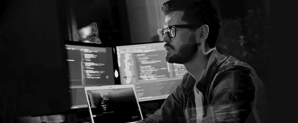 Man doing work at his desk on computer